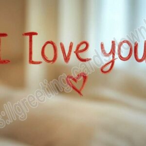 I love you card written in red lipstick on the mirror.