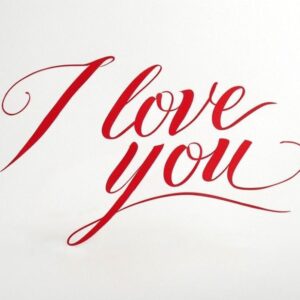 I love you card with red inscription on white background.