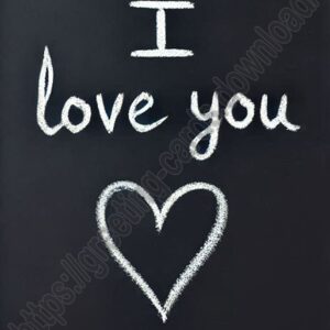 I love you card written in chalk on a black board.
