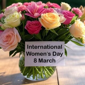 International women's day 8 March. Greeting e-card with roses and lilies in a glass vase.